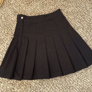 Pleated black skirt.